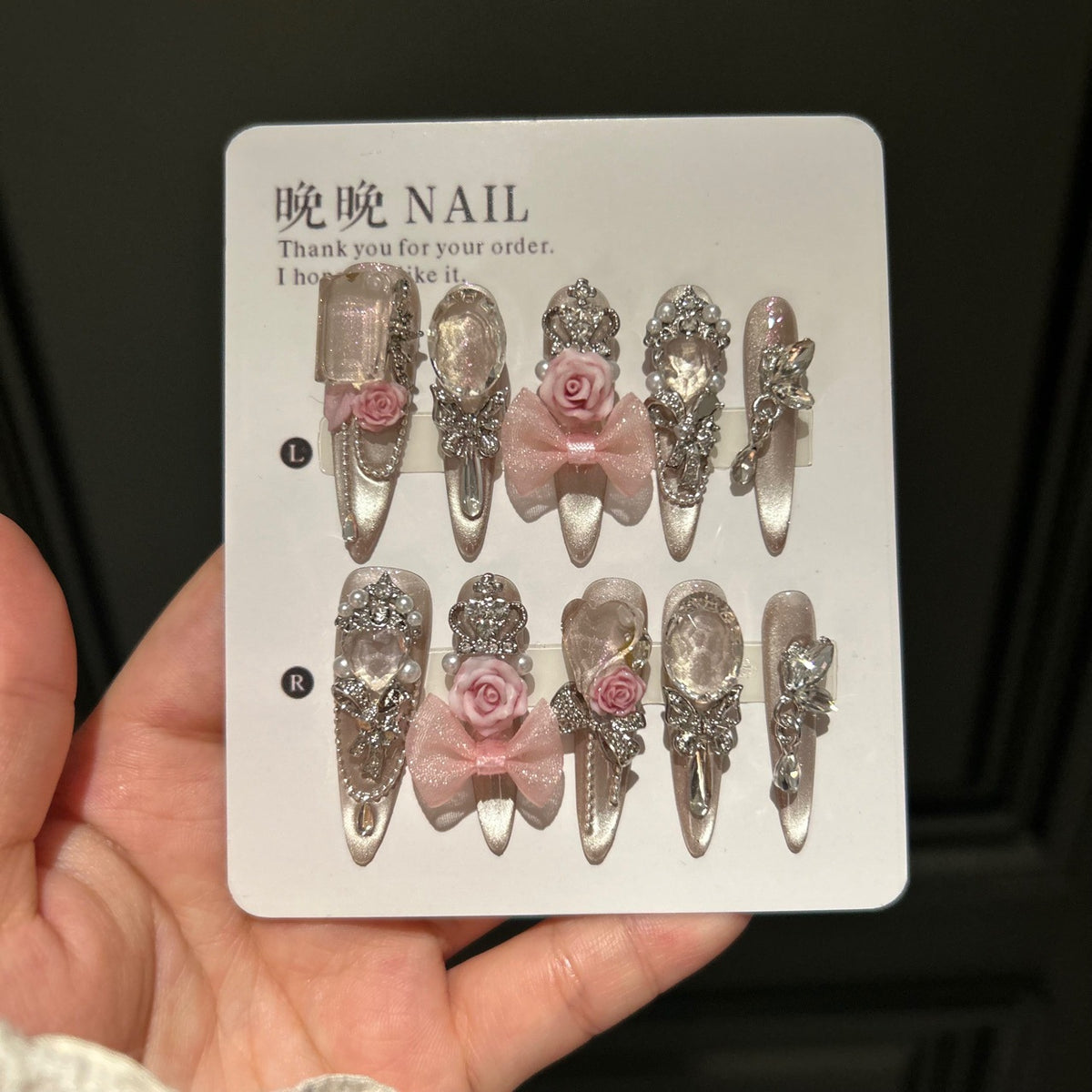 Champagne Nude Cat Eye Stiletto Press-on Nails with Oversized Crystals, 3D Pink Rose, Sheer Bow, Crown, and Crystal Draping Charm - Luxury Glam Fake Nail Set