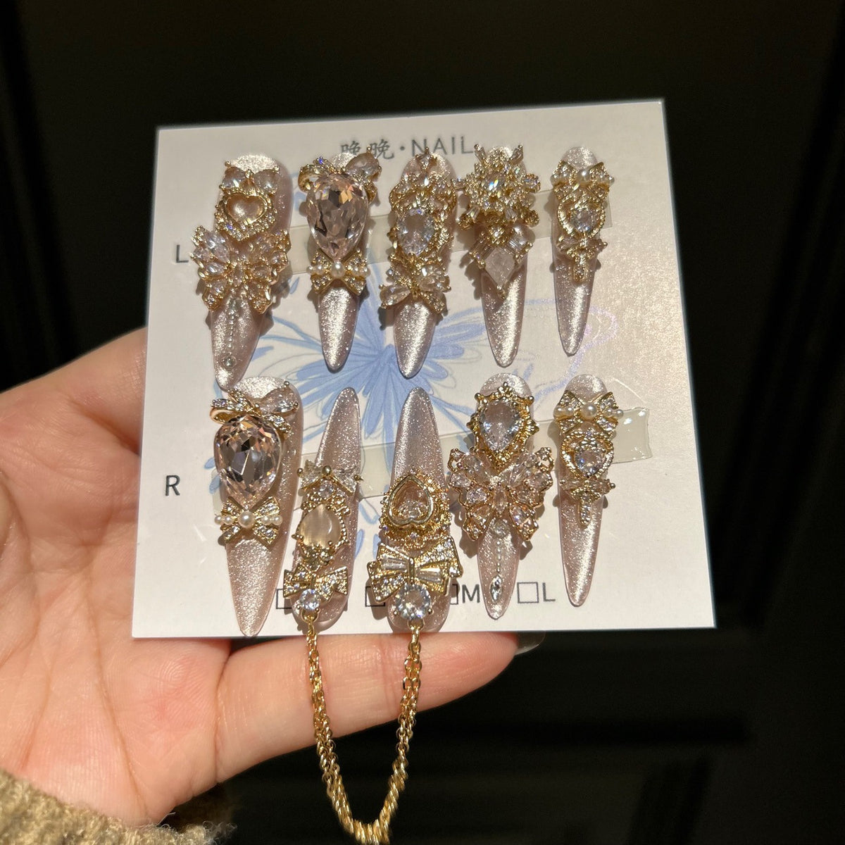Champagne Pink Cat Eye Stiletto Press-on Nails with 3D Bowknot, Crystal Jewels, and Hanging Chain Charms - Luxury Statement Fake Nail Set