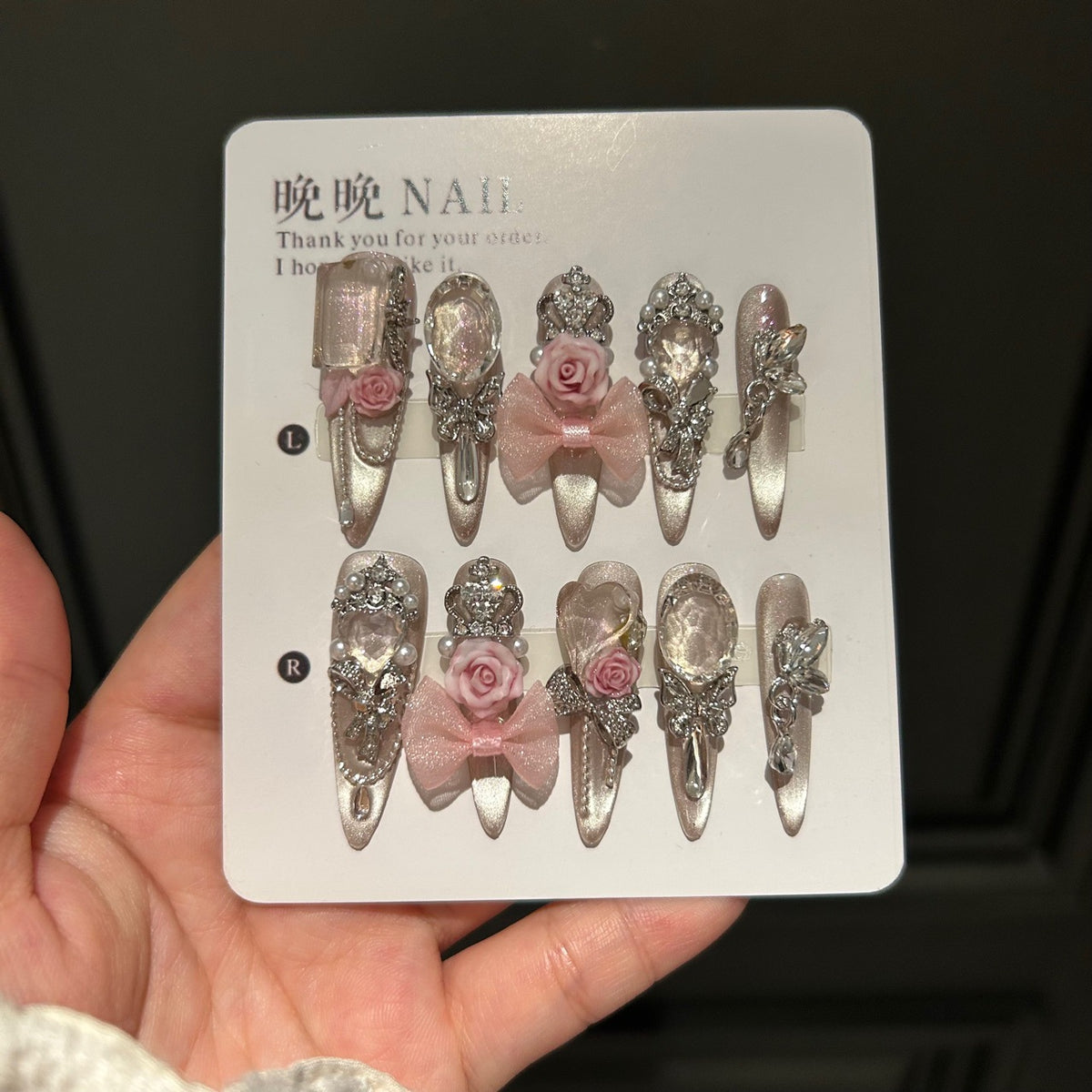 Champagne Nude Cat Eye Stiletto Press-on Nails with 3D Pink Rose, Sheer Bow, Crown, Crystal Frame, and Draping Charm - Luxury Glam Fake Nail Set