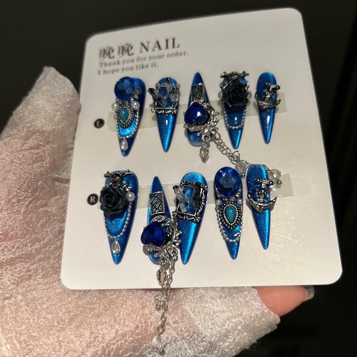 Royal Blue Cat Eye Stiletto Press-on Nails with Oversized Blue Crystals, 3D Black Rose, Skull, Vintage Frame, and Interlinked Chain - Gothic Cyber Fake Nail Set