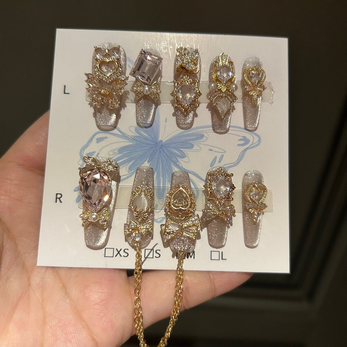 Champagne Silver Cat Eye Coffin Press-on Nails with 3D Bowknot, Crystal Jewels, and Hanging Chain Charms - Luxury Statement Fake Nail Set