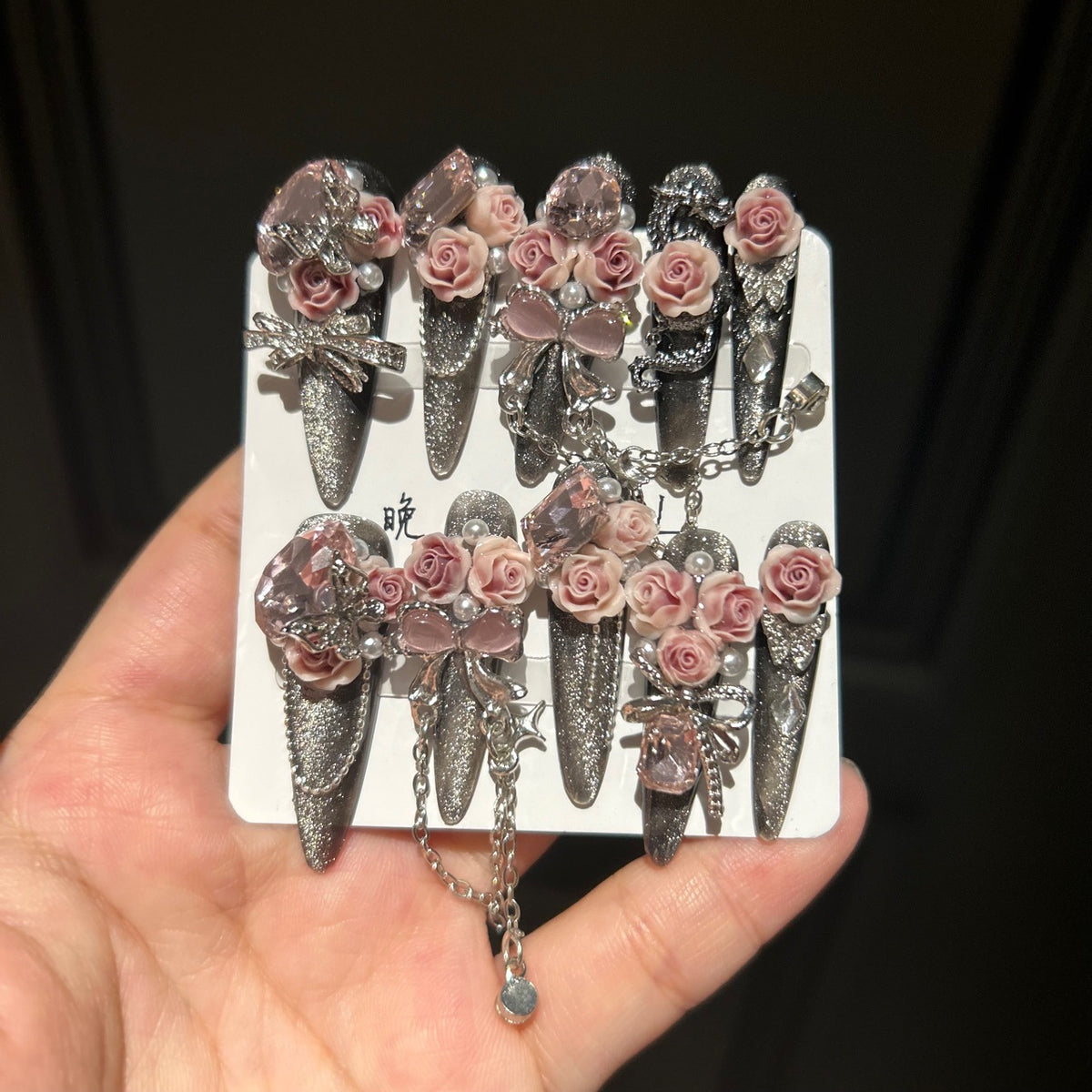 Handmade Dark Glitter Long Stiletto Press On Nails with 3D Dusty Pink Roses, Pink Crystal Charms, Bows, Butterfly Rhinestones & Interlinked Silver Chains