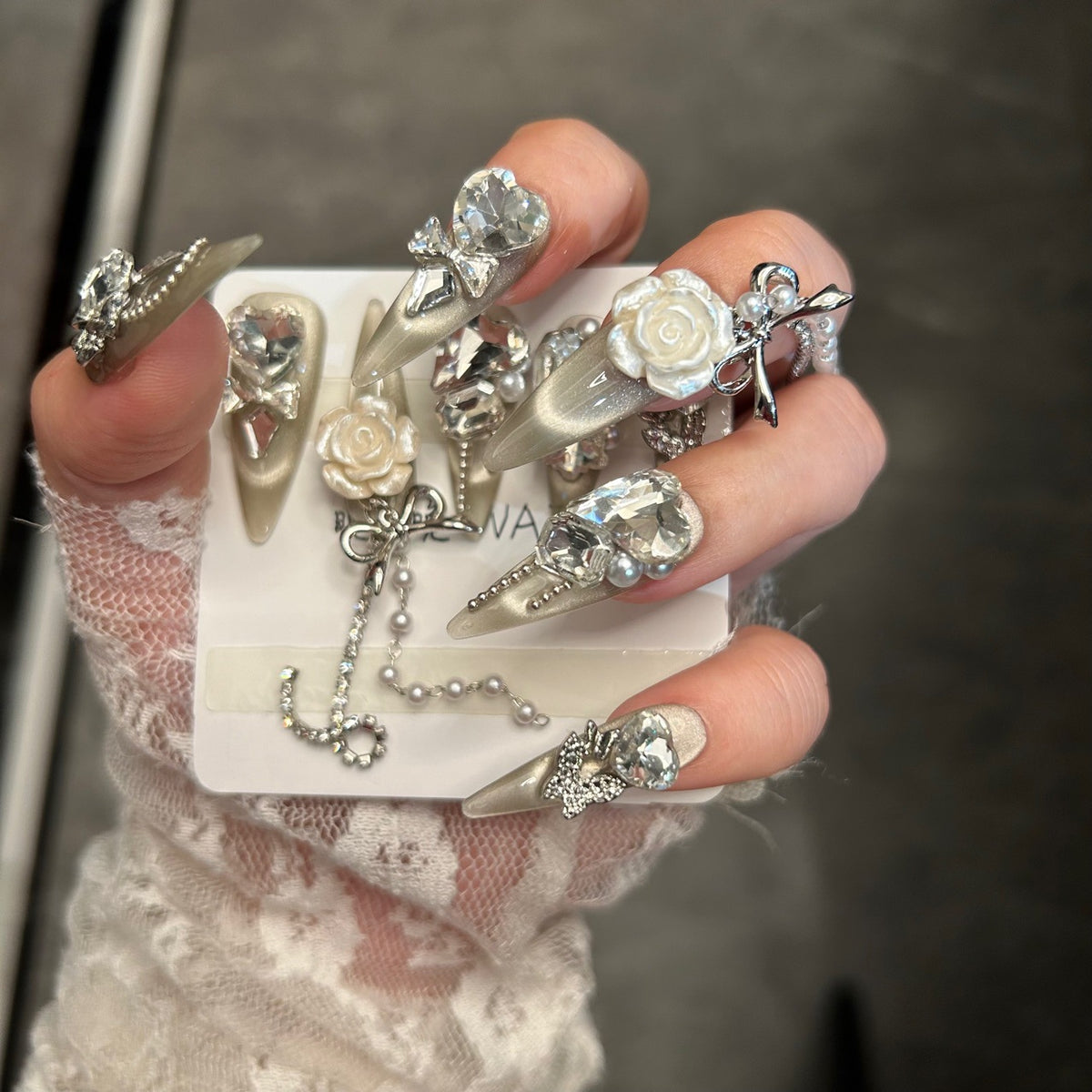 Champagne Cat Eye Stiletto Press-on Nails with Oversized Crystal Diamonds, 3D White Rose, Bow, and Pearl Rhinestone Chain - Luxury Glam Fake Nail Set