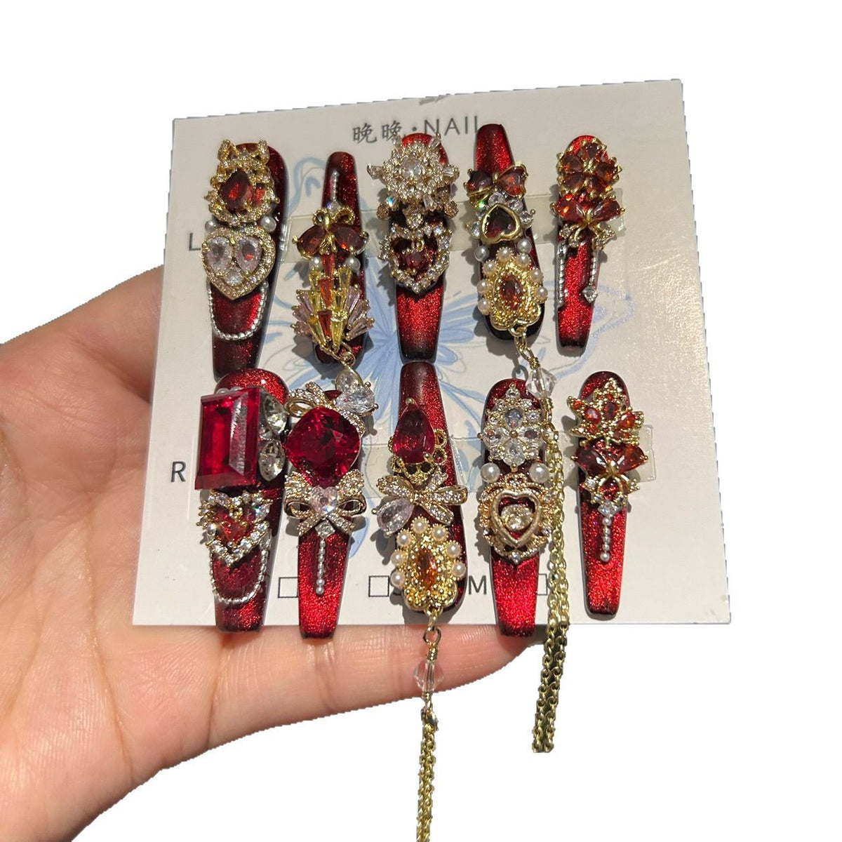 Handcrafted Designer Ruby Press-on Nails - Shimmering Cat Eye Base with Heavy 3D Red Gemstones, Gold Filigree and Chain Drops