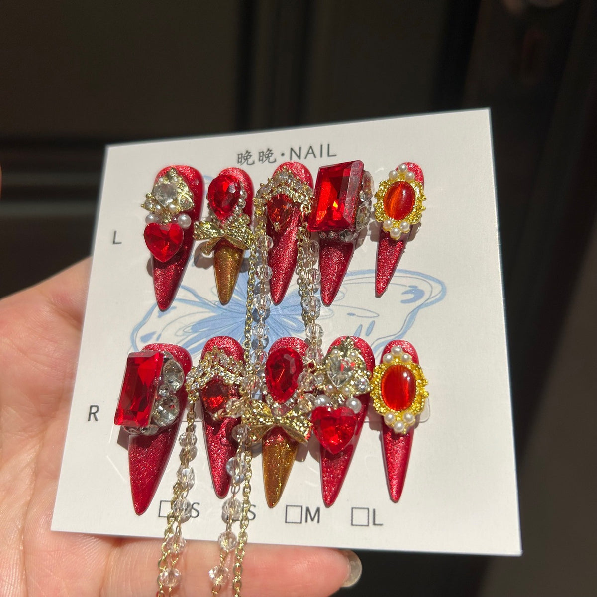 Handmade Red Glitter Press On Nails, Long Stiletto Luxury Royal False Nails with Large Ruby Rhinestones, Gold Charms, Pearls & Long Dangling Crystal Chains, Reusable Fake Nails for Party, Cosplay & Holiday