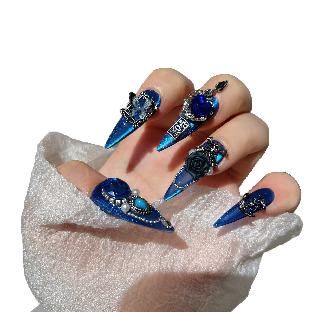 Royal Blue Cat Eye Stiletto Press-on Nails with Oversized Blue Crystals, 3D Black Rose, Skull, Vintage Frame, and Interlinked Chain - Gothic Cyber Fake Nail Set