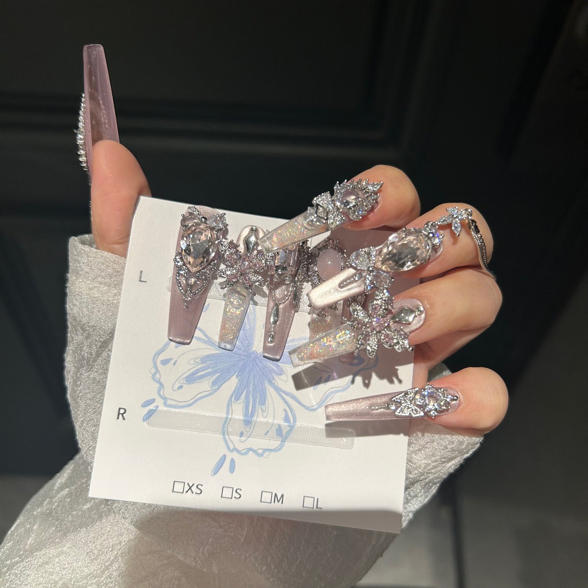 Smoky Pink Cat Eye Coffin Press-on Nails with Over-sized Pink Crystal Gems, Silver Bow, and Hanging Chain - Luxury Glam Fake Nail Set