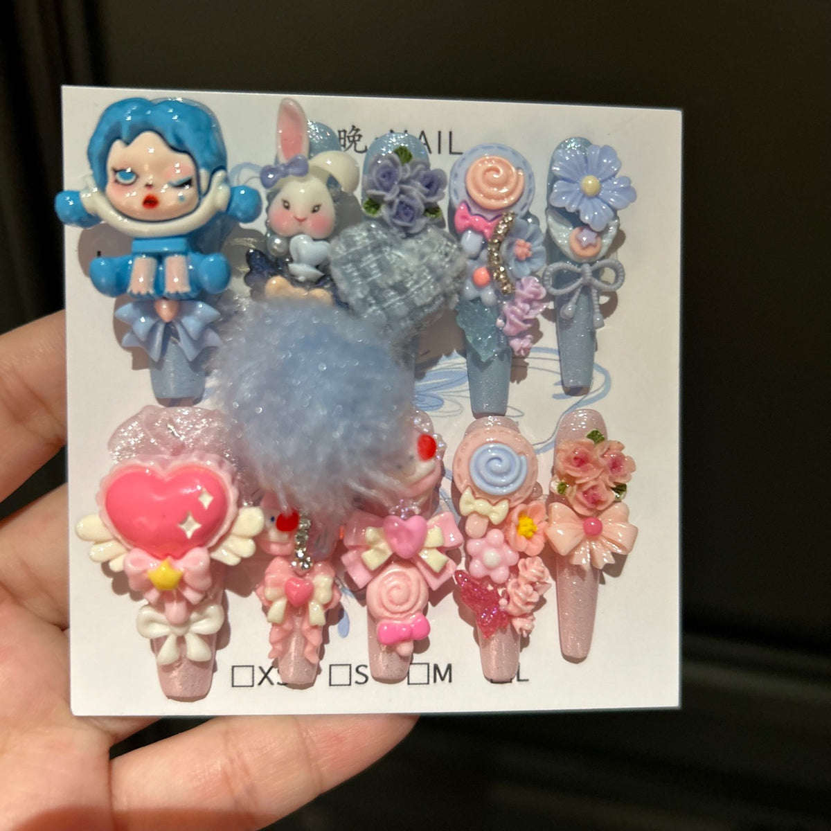 Y2K Blue and Pink Coffin Press-on Nails with 3D Anime Doll, Fluffy Pom-Pom, Lollipop, and Cute Cartoon Charms - Sweet & Cool Fake Nail Set