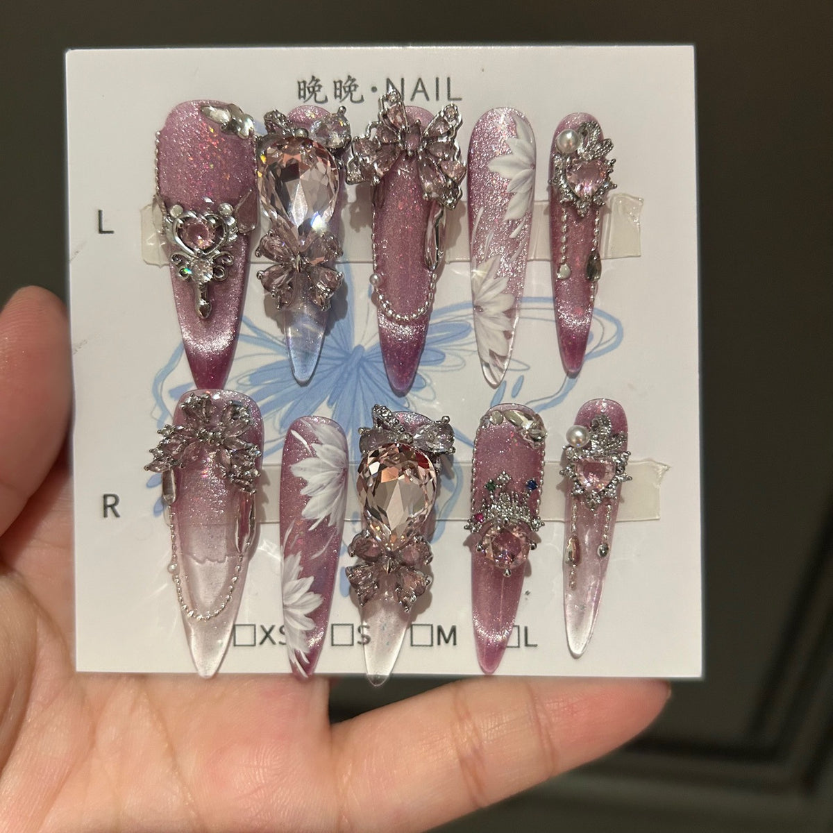 Handcrafted Designer Pink Press-on Nails - Shimmering Cat Eye Base with Intricate 3D Floral, Rhinestones and Chain Drops