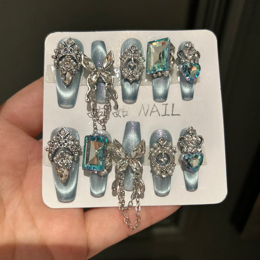 Handmade Ice Blue Cat Eye Long Coffin Press On Nails with Giant Aqua Crystals, Silver Butterfly Charms, Crown Ornaments & Hanging Chain Tassels