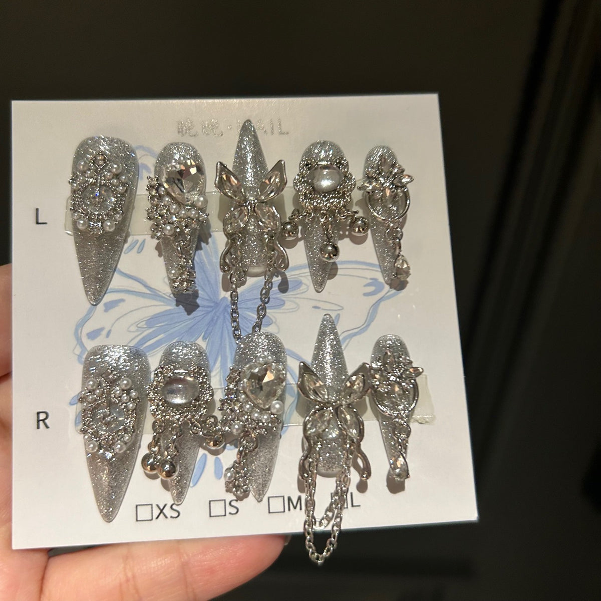 Handcrafted Designer Silver Press-on Nails - Shimmering Cat Eye Base with Heavy 3D Crystals, Pearls and Interconnected Chains