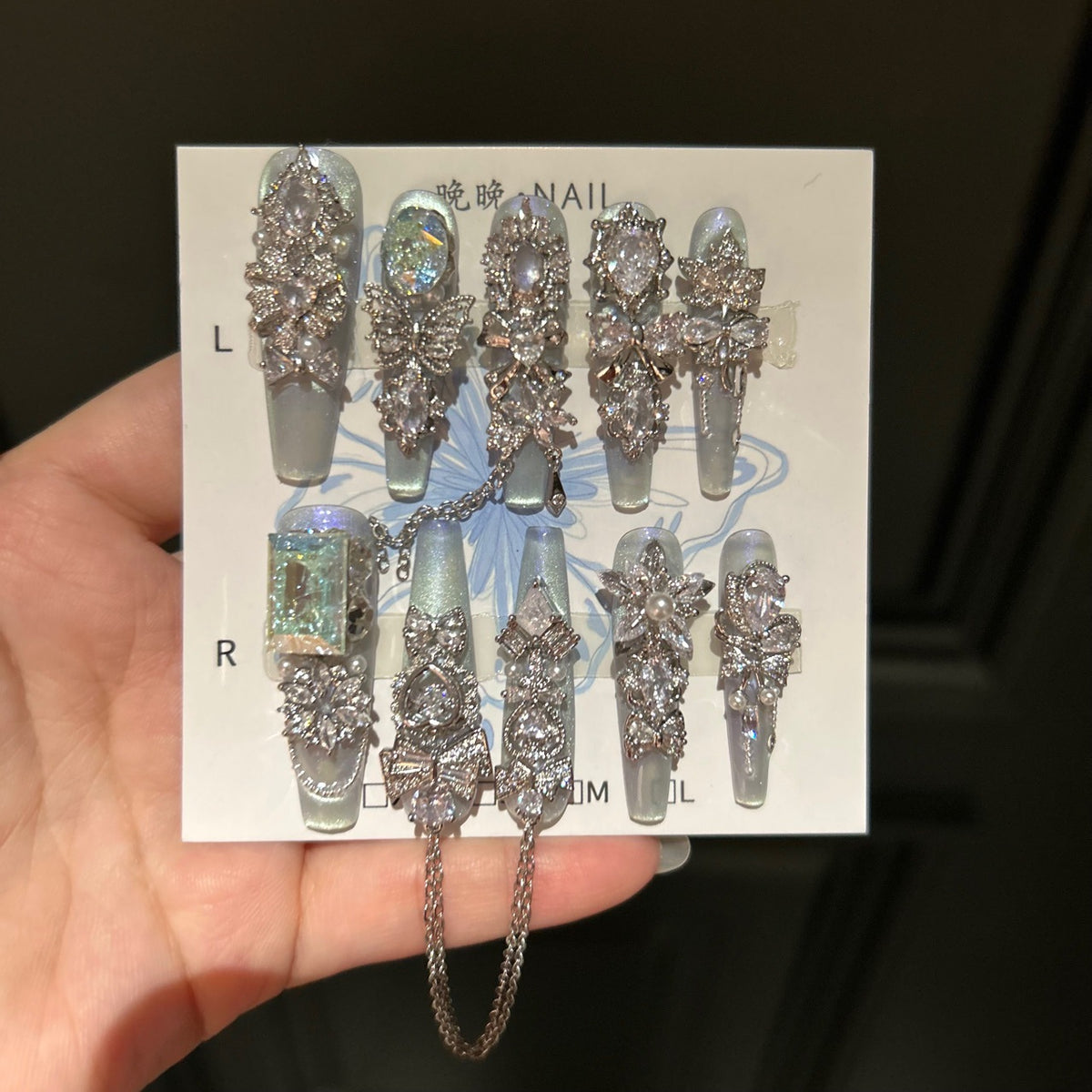 Silver Blue Cat Eye Coffin Press-on Nails with Over-sized Crystal Gems, Bowknot, and Interlinked Hanging Chain - Luxury Glam Fake Nail Set