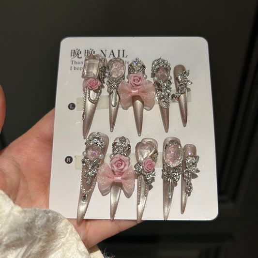 Champagne Nude Cat Eye Stiletto Press-on Nails with 3D Pink Rose, Sheer Bow, Crown, Crystal Frame, and Draping Charm - Luxury Glam Fake Nail Set