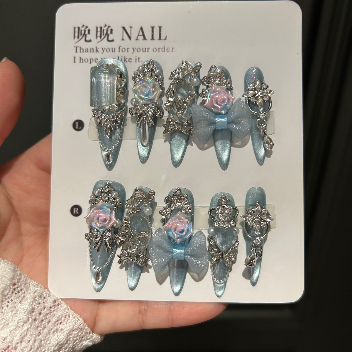 Handmade Ice Blue Cat Eye Long Stiletto Press On Nails with Iridescent 3D Roses, Glitter Bows, Butterfly Rhinestones, Pearls & Dangling Silver Chains