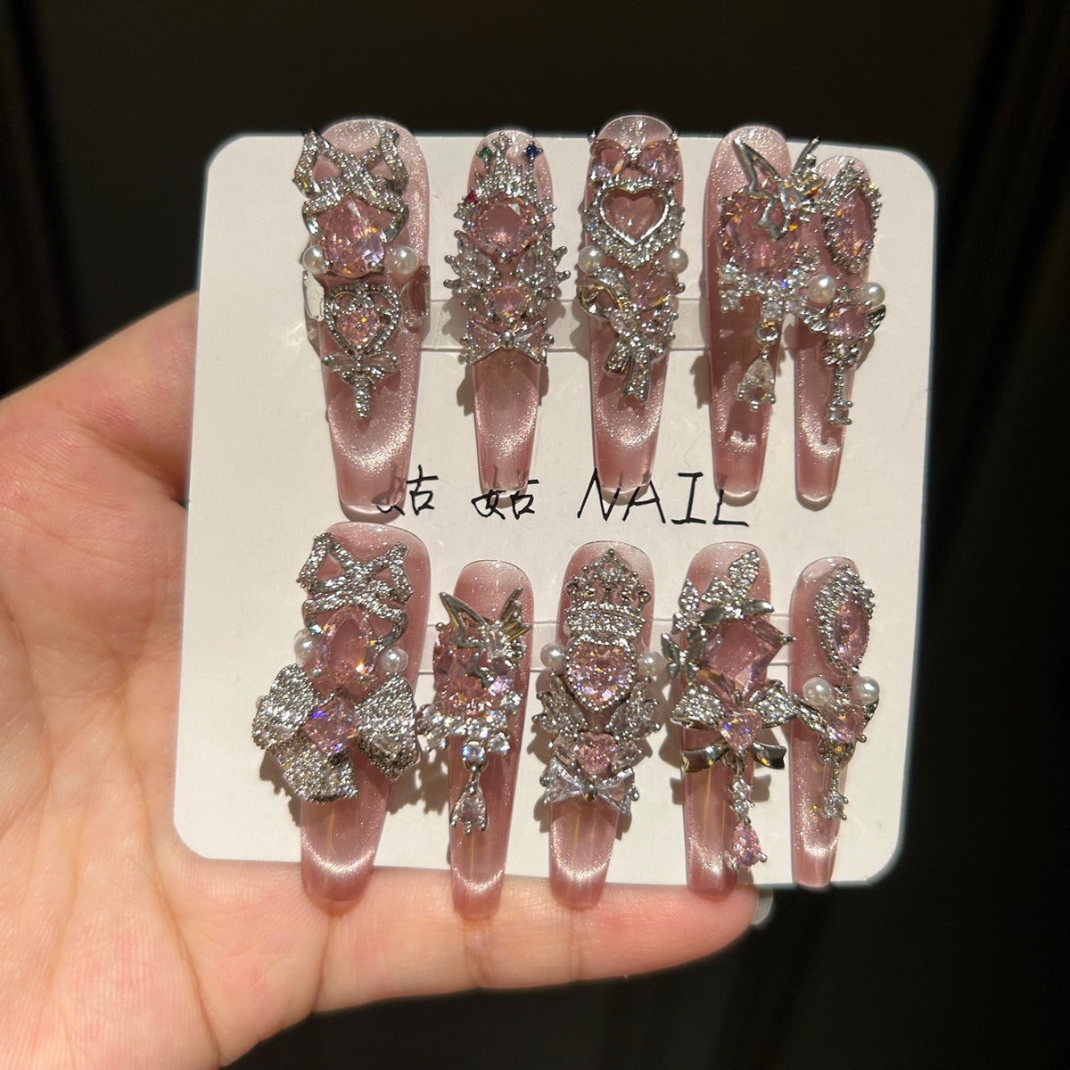 Handmade Pink Cat Eye Long Coffin Press On Nails with Pink Heart Crystals, Crown & Cross Rhinestone Ornaments, Pearl Accents & Dangling Charms