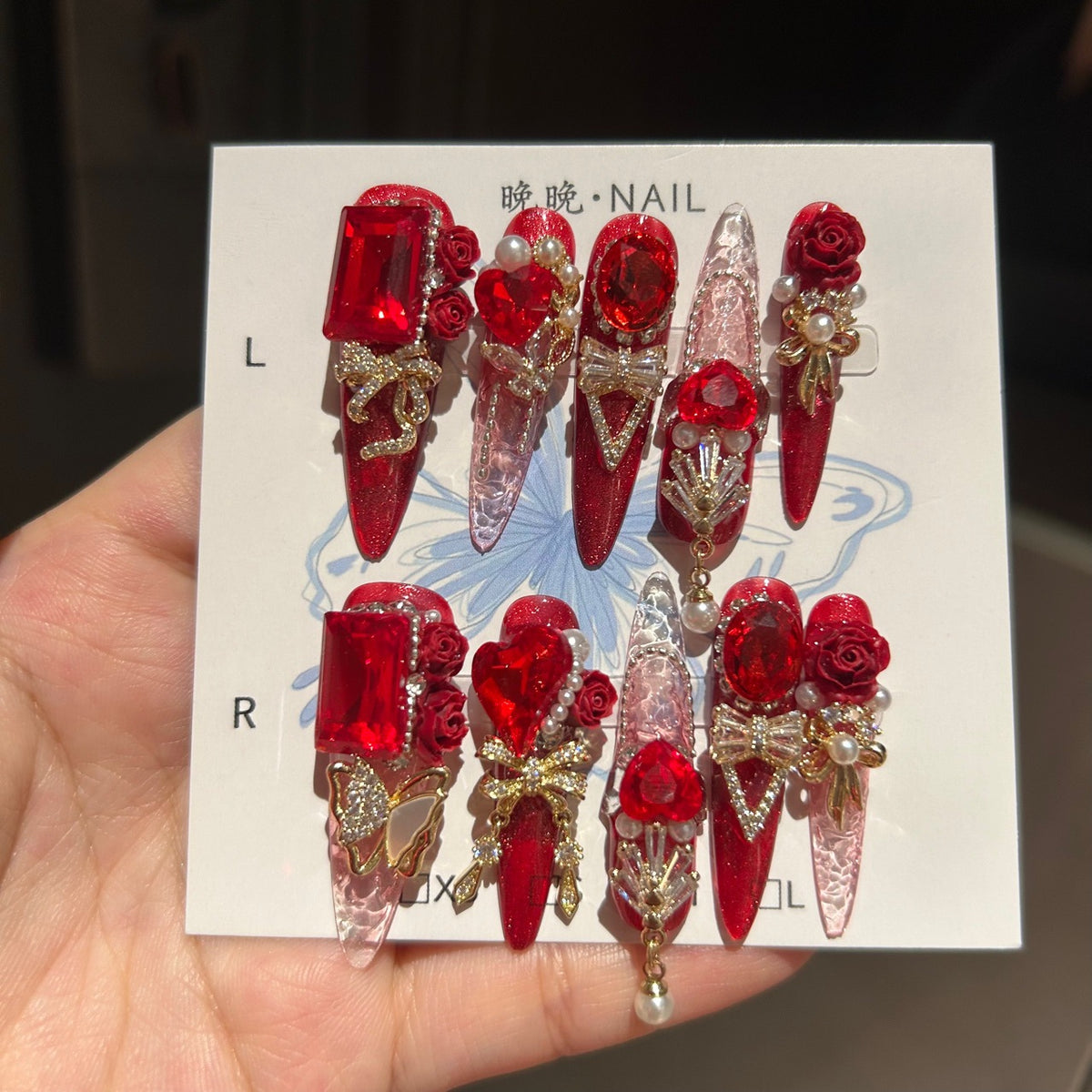 Ruby Red Cat Eye Stiletto Press-on Nails with 3D Rose, Crystal Rhinestone, and Hanging Chain Charms - Luxury Statement Fake Nail Set