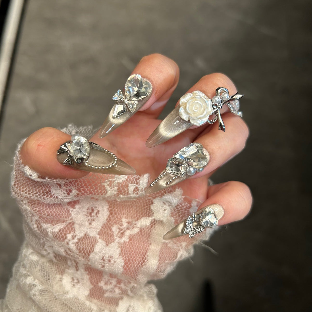 Champagne Cat Eye Stiletto Press-on Nails with Oversized Crystal Diamonds, 3D White Rose, Bow, and Pearl Rhinestone Chain - Luxury Glam Fake Nail Set