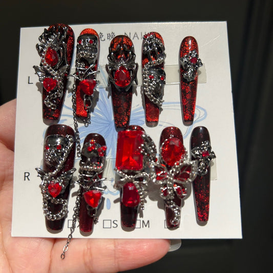 Handcrafted Designer Dark Aesthetic Press-on Nails - Shimmering Red-Black Base with Heavy 3D Gemstones, Skull Art and Chain Drops