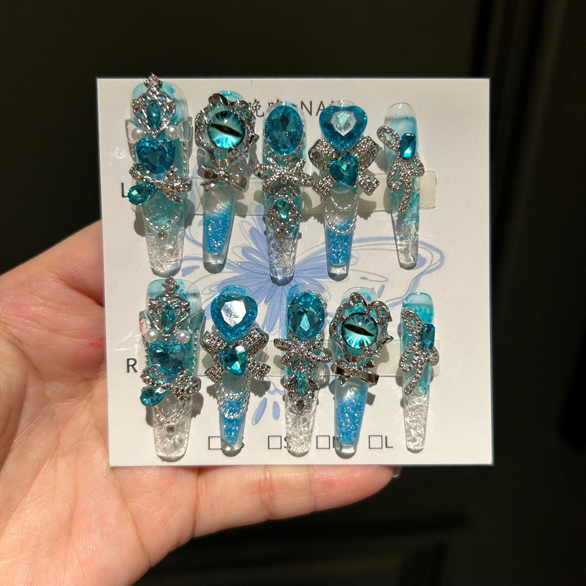 Handmade Blue Glitter Gradient Long Coffin Press On Nails with Blue Evil Eye Charms, Large Blue Heart Crystals, Rhinestone Bows & Silver Chains