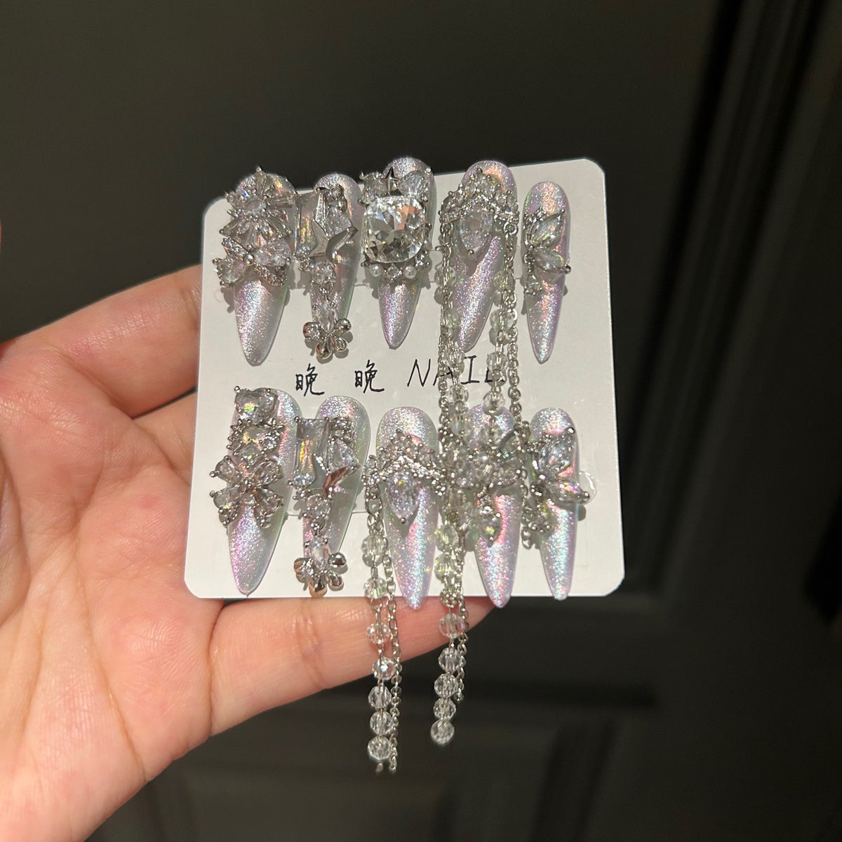 Holographic Silver Cat Eye Stiletto Press-on Nails with 3D Crystal Rhinestones, Over-sized Gem, and Beaded Hanging Chain Charms - Luxury Statement Fake Nail Set