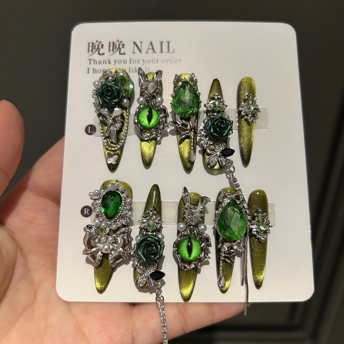 Handmade Olive Green Cat Eye Press On Nails, Long Stiletto Witch Fantasy False Nails with 3D Dark Green Roses, Green Devil Eye Charms, Emerald Rhinestones, Pearls, Silver Bows & Dangling Silver Chains, Reusable Fake Nails for Cosplay, Halloween & Party