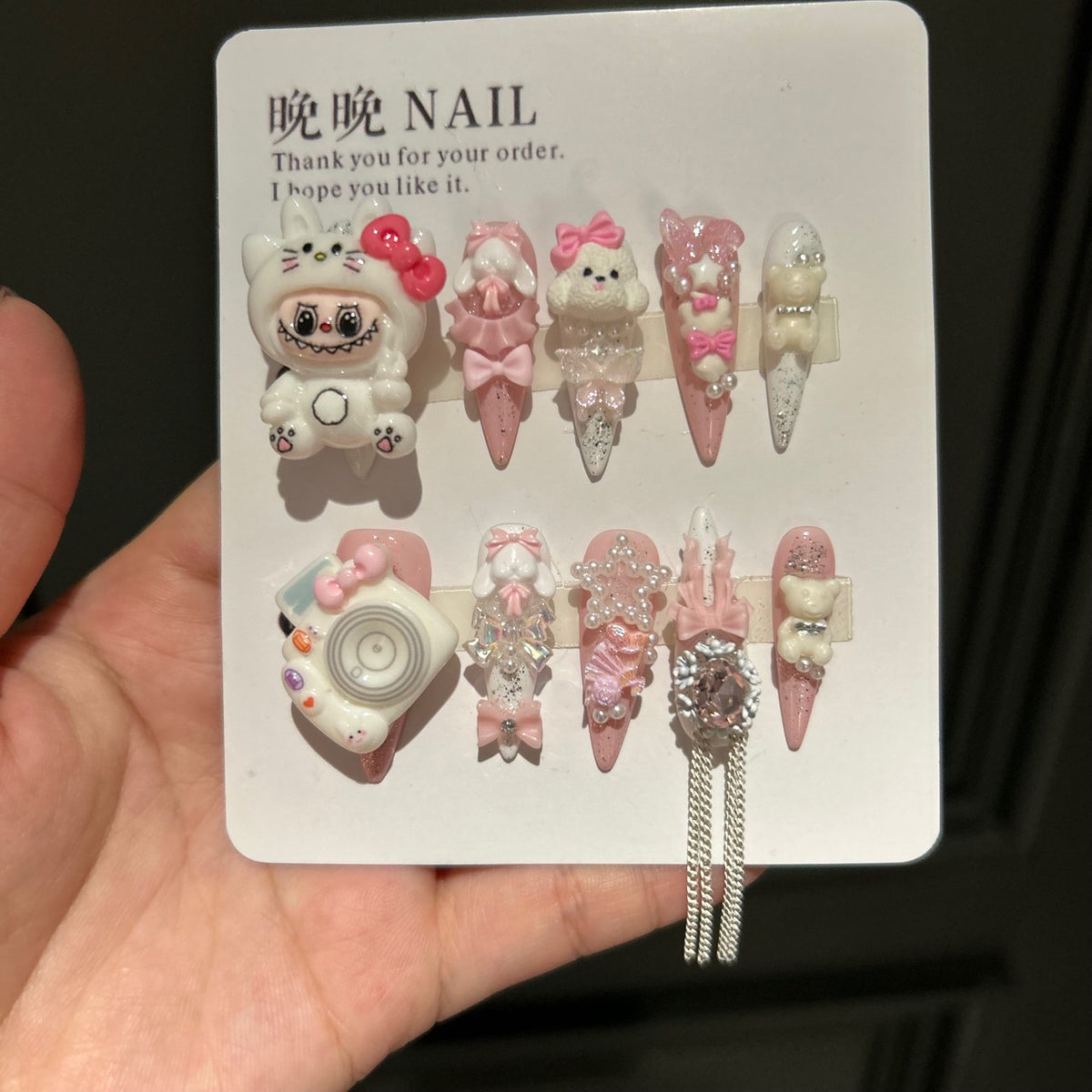 Handmade Pink White Press On Nails, Long Stiletto Kawaii False Nails with 3D Labubu Doll, Bunny, Bear & Camera Charms, Bows, Star Rhinestones & Silver Tassel Chains, Reusable Fake Nails for Cosplay & Birthday Party