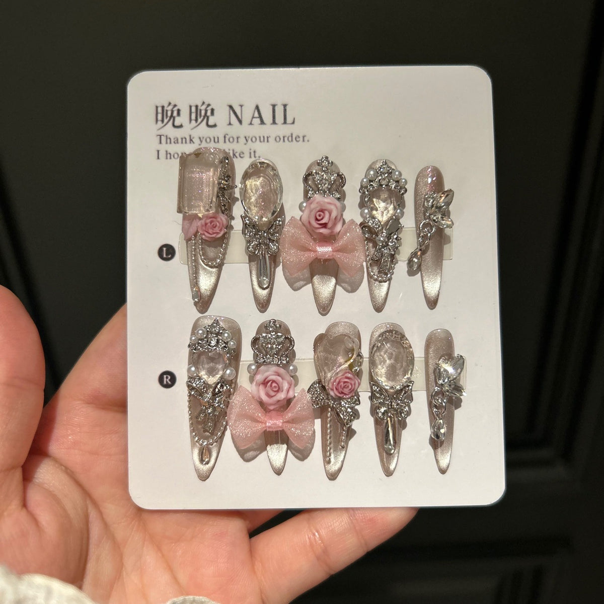 Champagne Nude Cat Eye Stiletto Press-on Nails with Oversized Crystals, 3D Pink Rose, Sheer Bow, Crown, and Crystal Draping Charm - Luxury Glam Fake Nail Set