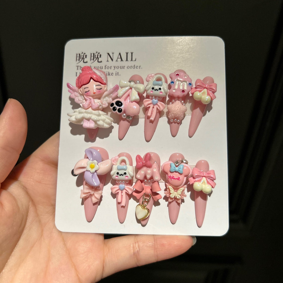Handmade Baby Pink Long Stiletto Press On Nails with 3D Angel Doll, Cute Cartoon Charms, Bows & Heart Chain Tassels