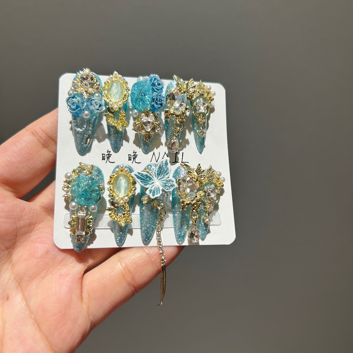 Handmade Turquoise Glitter Long Stiletto Press On Nails with 3D Blue Roses, Lace Butterfly, Gold Frame Charms & Dangling Chains