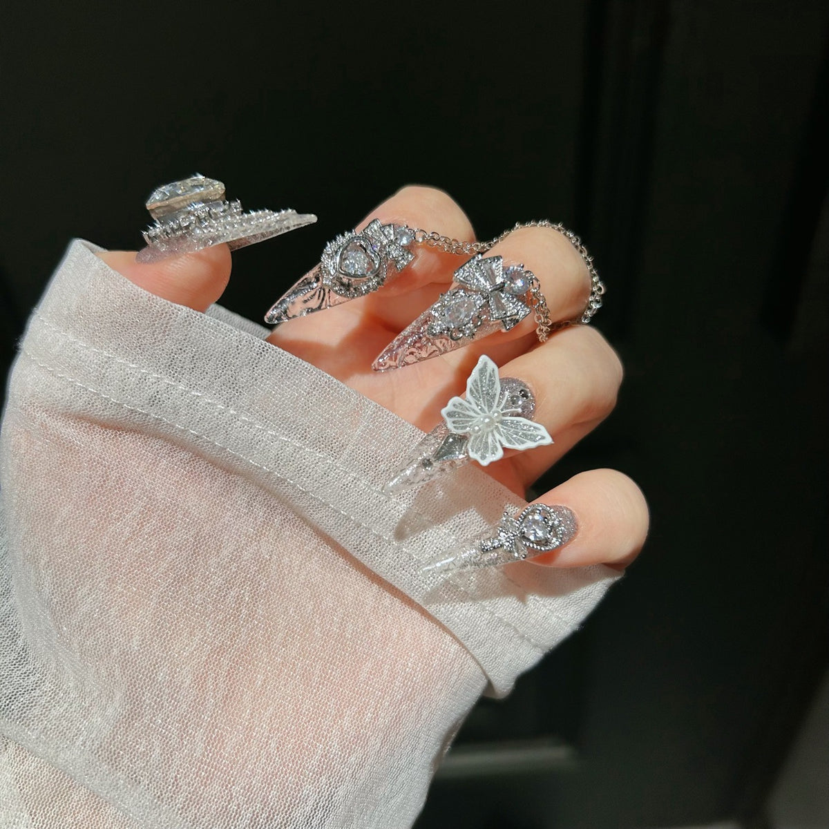 Handmade Silver Glitter Clear Long Stiletto Press On Nails with 3D White Butterfly Charms, Large Heart Crystals, Rhinestone Bows & Dangling Chains
