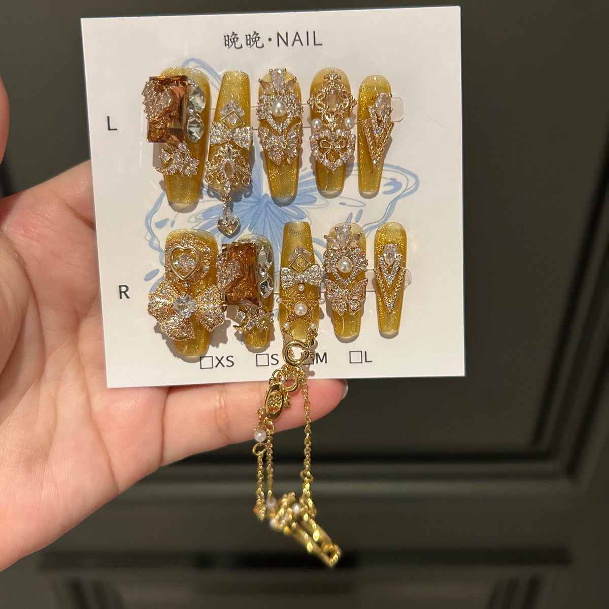Gold Cat Eye Coffin Press-on Nails with 3D Bowknot, Crystal Rhinestones, and Connected Finger Ring Chain - Luxury Statement Fake Nail Set