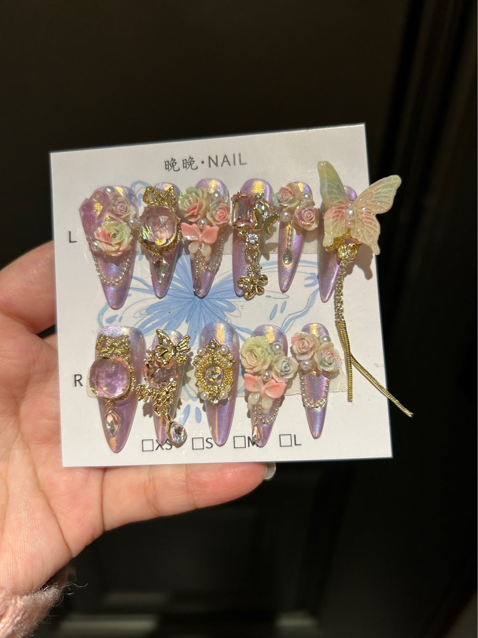 Holographic Purple-Pink Cat Eye Stiletto Press-on Nails with Oversized Fairy Butterfly, 3D Gradient Roses, Vintage Gold Frame, and Draping Chain - Fantasy Glam Fake Nail Set