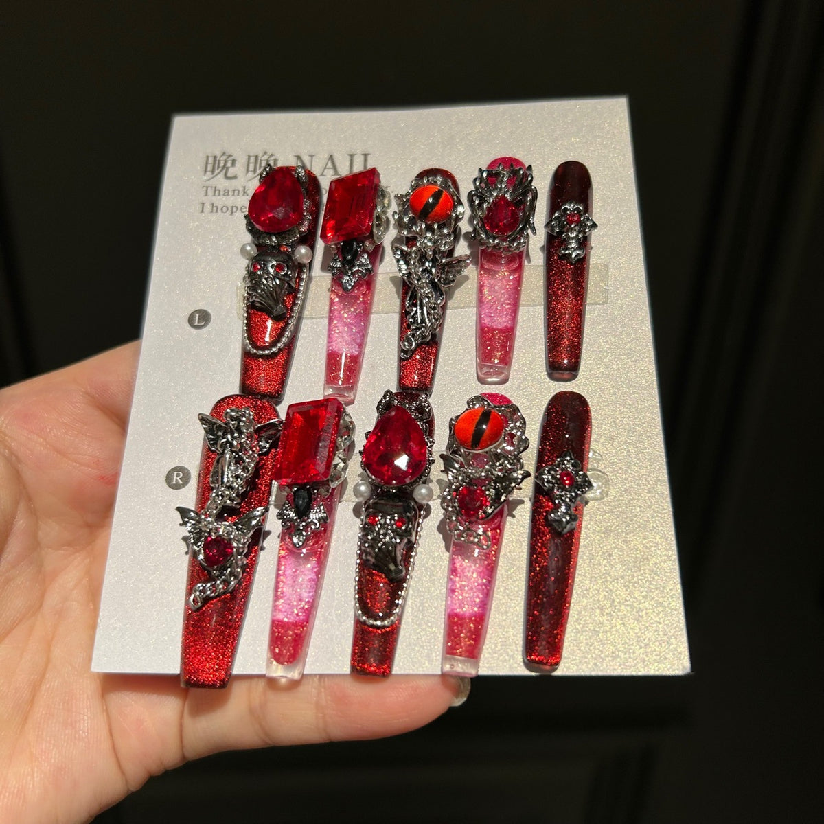 Handcrafted Designer Dark Aesthetic Press-on Nails - Shimmering Red-Black Base with Heavy 3D Gemstones, Skull Art and Cross Decals
