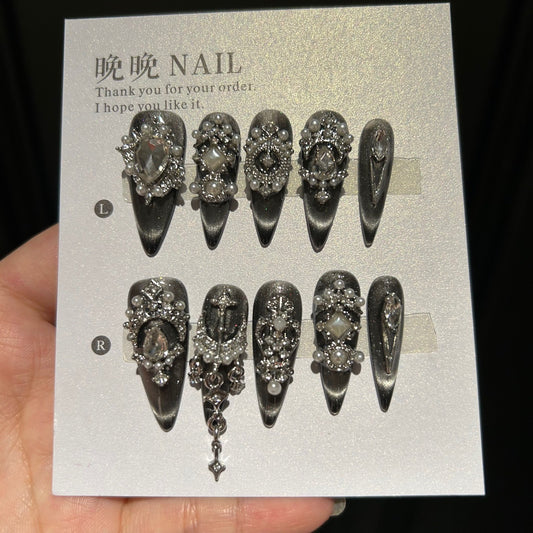 Handmade Black Silver Cat Eye Press On Nails, Long Stiletto Gothic False Nails with Cross Charms, Pearls, Large Rhinestones & Dangling Chain, Reusable Fake Nails for Party & Cosplay