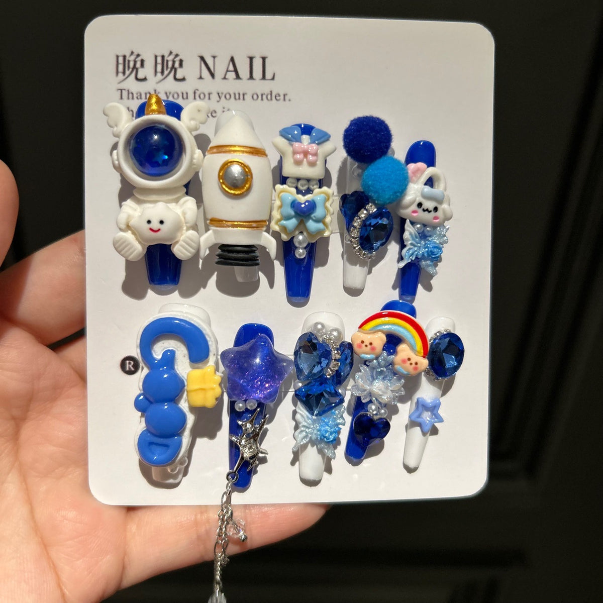 Klein Blue & White Stiletto Press-on Nails with 3D Astronaut, Rocket, Rainbow Bear, Fluffy Ball, and Interlinked Chain - Space Kawaii Fake Nail Set