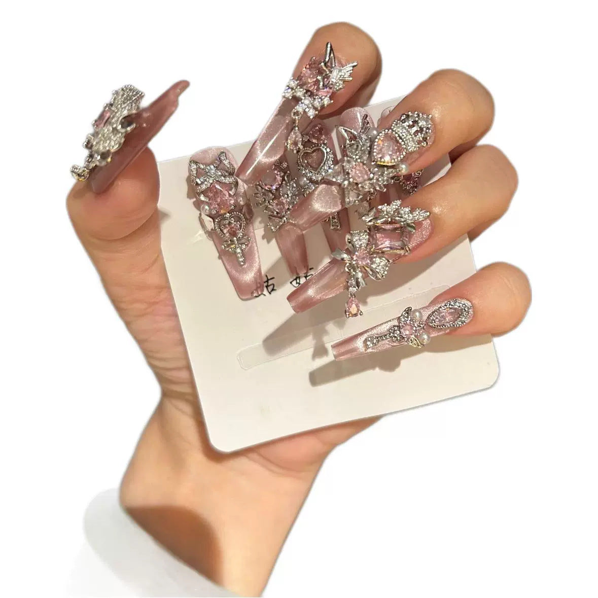 Handmade Pink Cat Eye Long Coffin Press On Nails with Pink Heart Crystals, Crown & Cross Rhinestone Ornaments, Pearl Accents & Dangling Charms