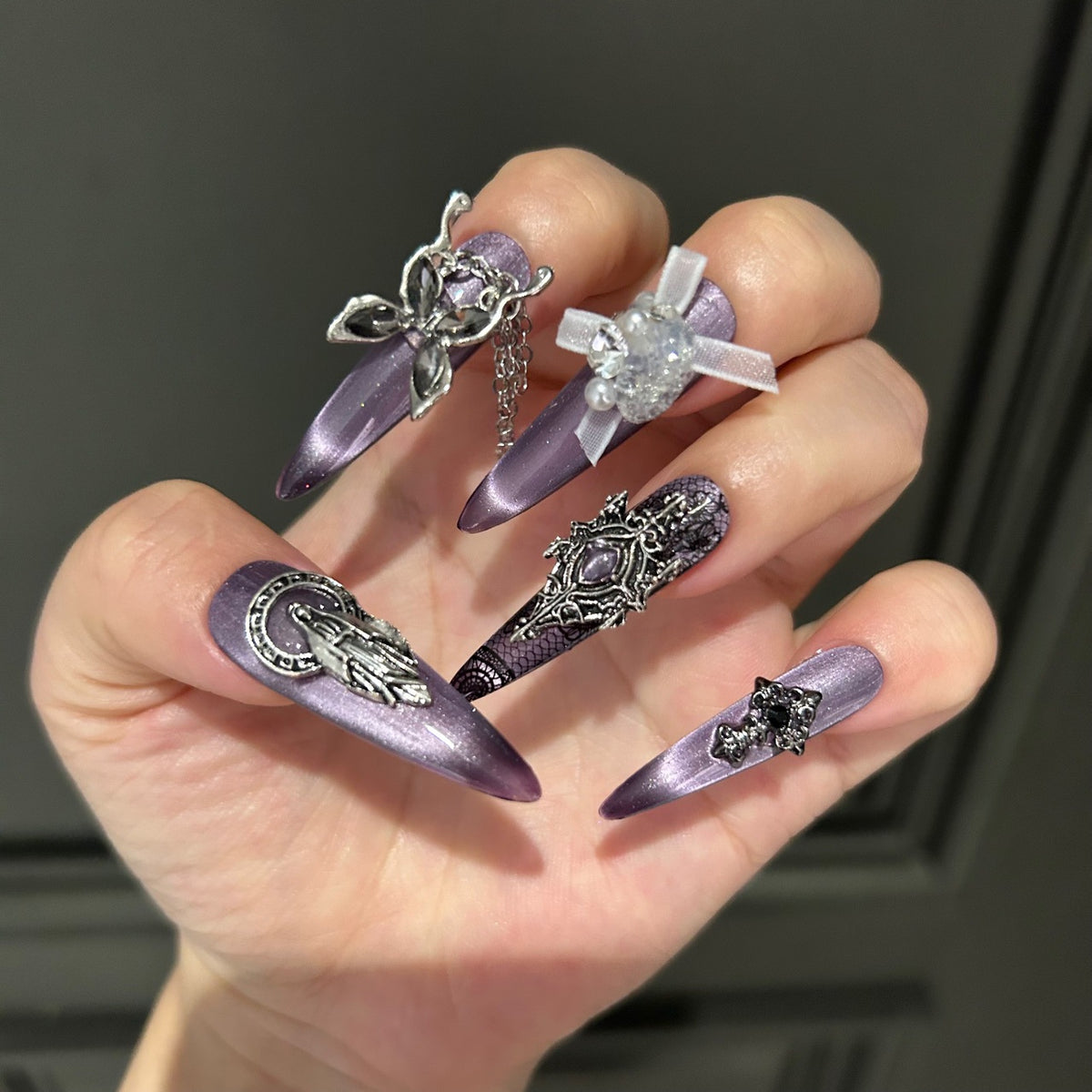 Dark Grey-Purple Cat Eye Stiletto Press-on Nails with Vintage Silver Religious Relief, Lace Pattern, White Ribbon Bow, Butterfly, and Draping Chain - Gothic Glam Fake Nail Set
