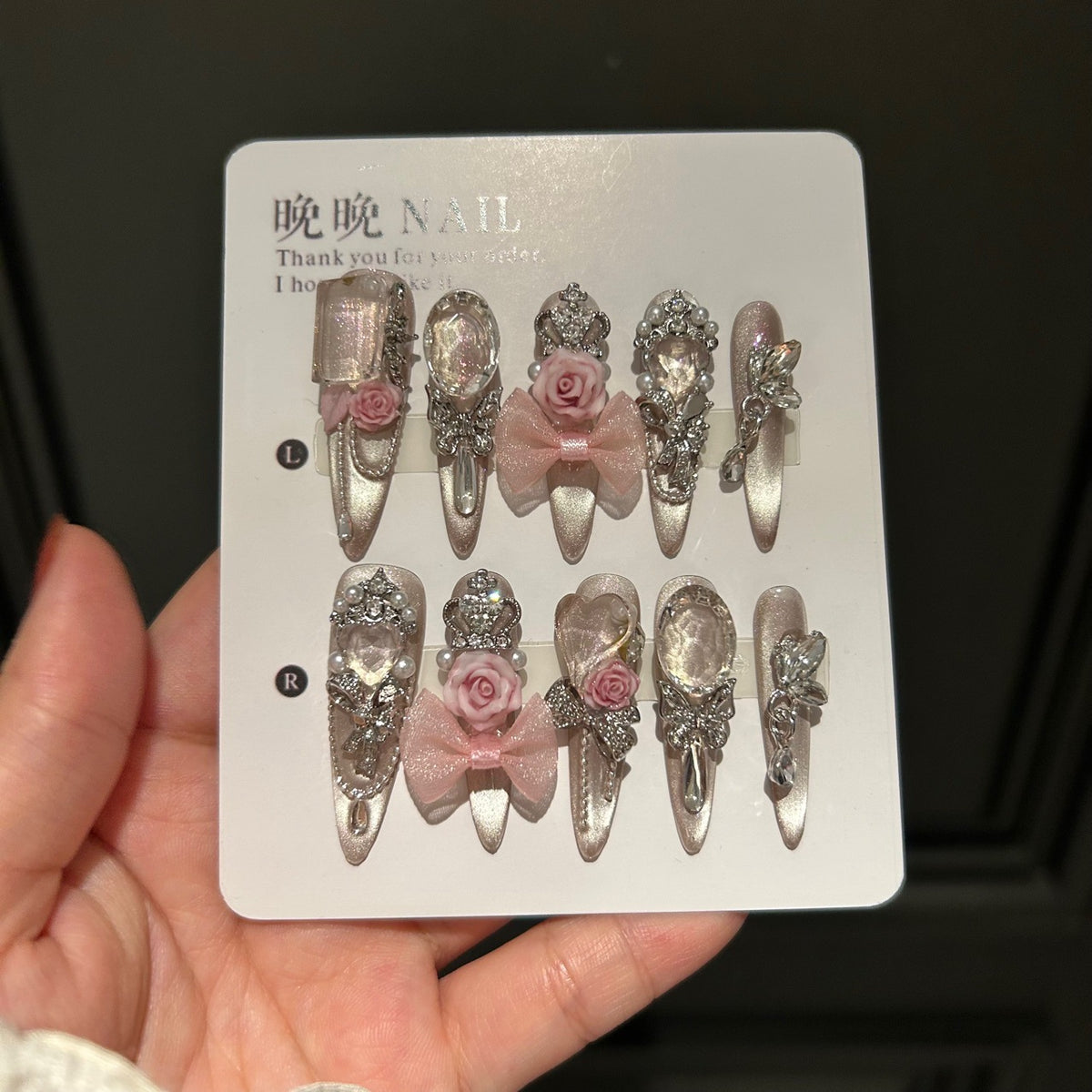 Champagne Nude Cat Eye Stiletto Press-on Nails with 3D Pink Rose, Sheer Bow, Crown, Crystal Frame, and Draping Charm - Luxury Glam Fake Nail Set
