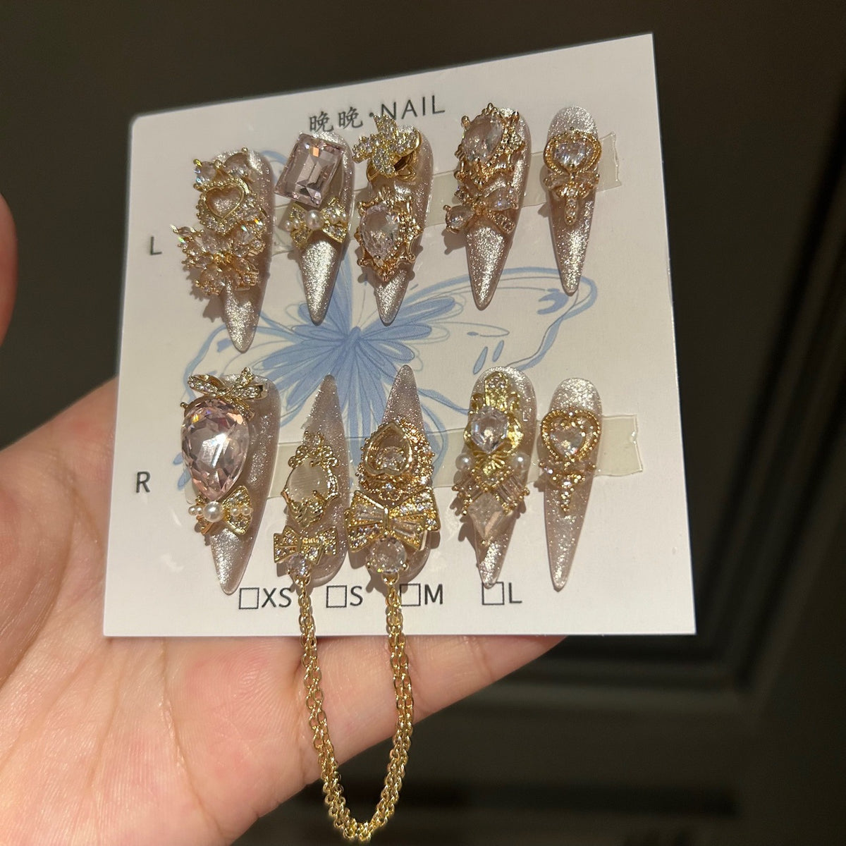Champagne Silver Cat Eye Coffin Press-on Nails with 3D Bowknot, Crystal Jewels, and Hanging Chain Charms - Luxury Statement Fake Nail Set