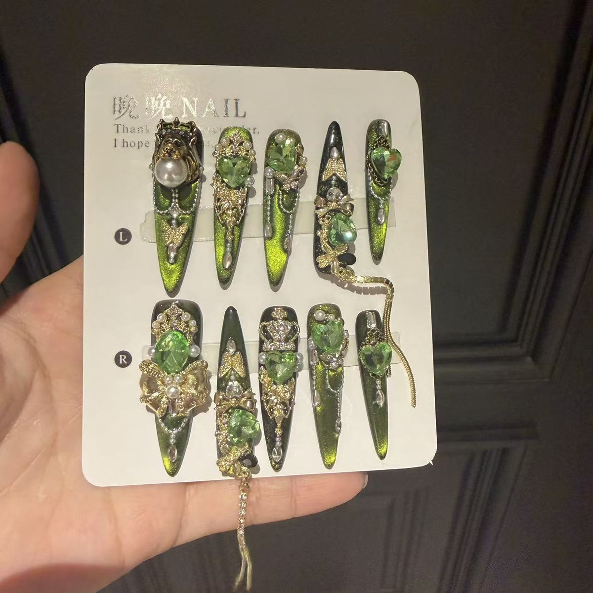Green Cat Eye Stiletto Press-on Nails with 3D Crown, Crystal Rhinestone, and Chain Charms - Luxury Goth Fake Nail Set