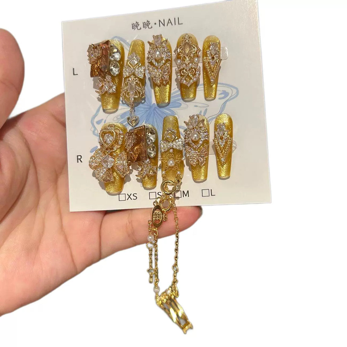 Gold Cat Eye Coffin Press-on Nails with 3D Bowknot, Crystal Rhinestones, and Connected Finger Ring Chain - Luxury Statement Fake Nail Set