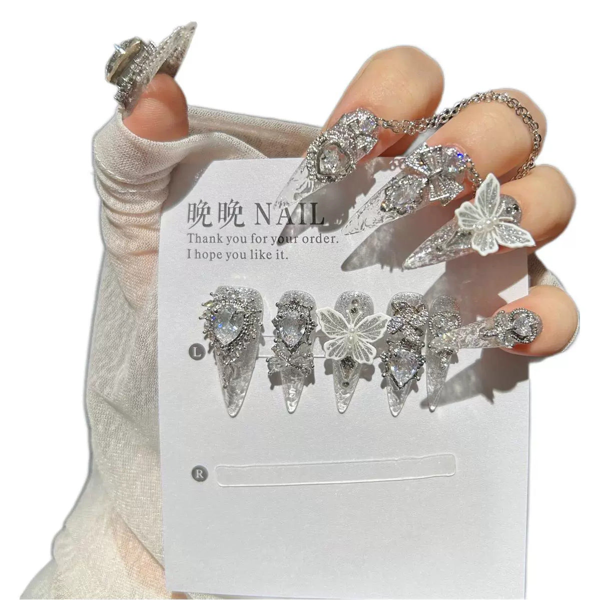 Handmade Silver Glitter Clear Long Stiletto Press On Nails with 3D White Butterfly Charms, Large Heart Crystals, Rhinestone Bows & Dangling Chains