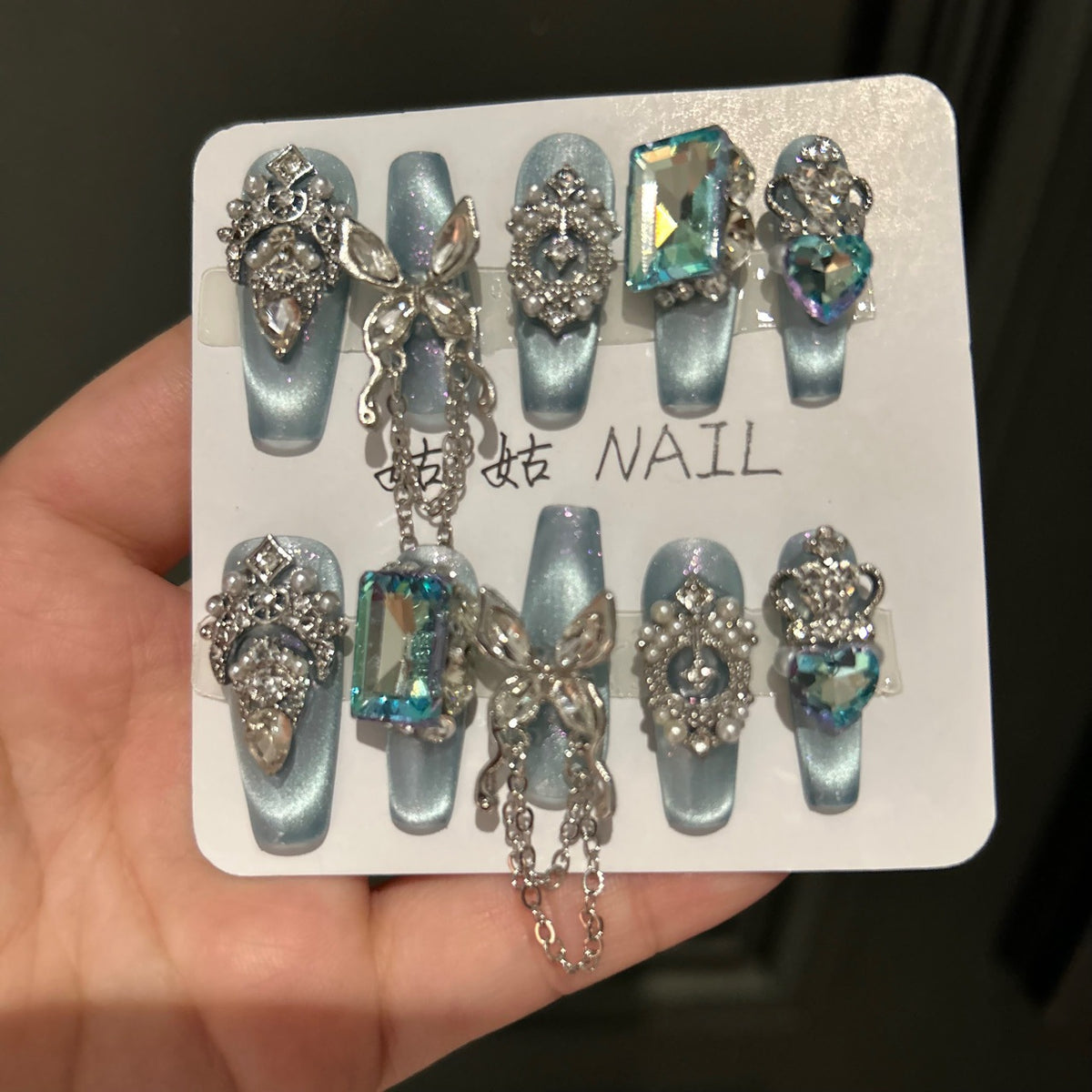 Handmade Ice Blue Cat Eye Long Coffin Press On Nails with Giant Aqua Crystals, Silver Butterfly Charms, Crown Ornaments & Hanging Chain Tassels