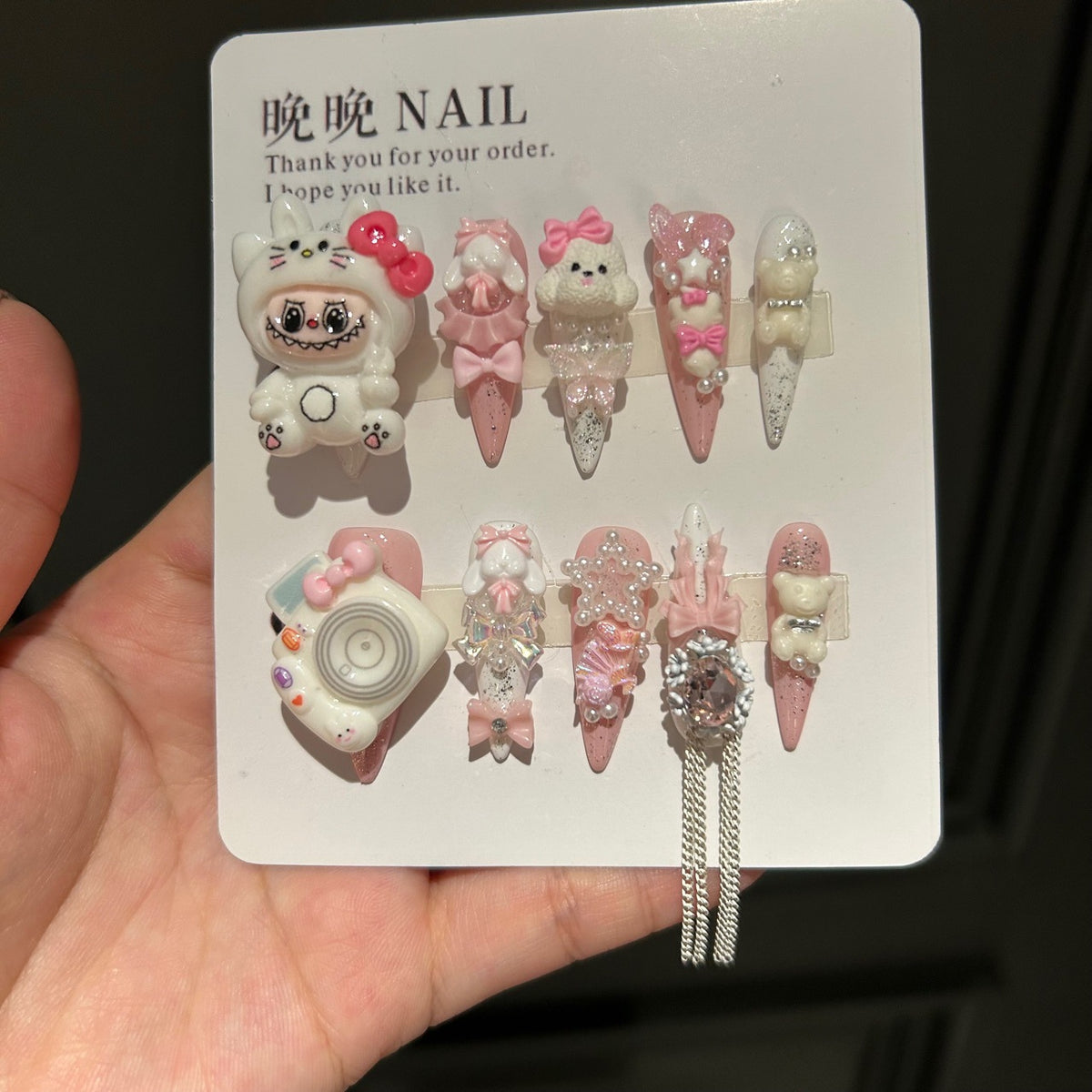 Handmade Pink White Press On Nails, Long Stiletto Kawaii False Nails with 3D Labubu Doll, Bunny, Bear & Camera Charms, Bows, Star Rhinestones & Silver Tassel Chains, Reusable Fake Nails for Cosplay & Birthday Party
