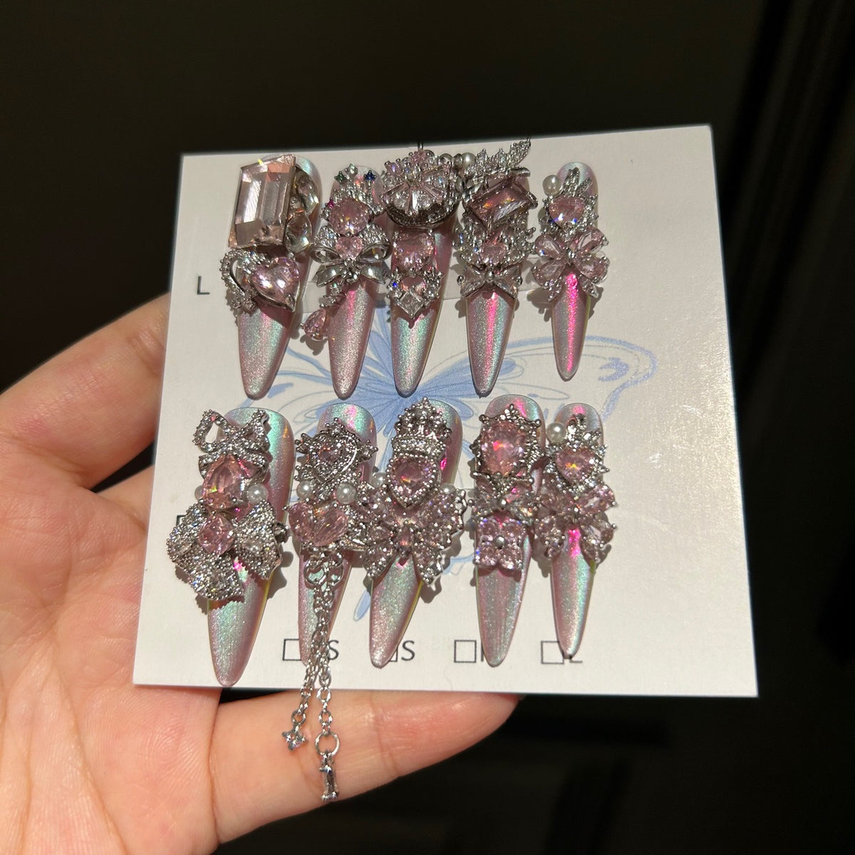 Holographic Pink Cat Eye Stiletto Press-on Nails with 3D Pink Crystal Gems, Bowknot, and Hanging Chain Charms - Luxury Fairy Fake Nail Set