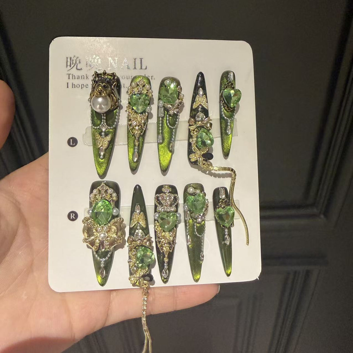Green Cat Eye Stiletto Press-on Nails with 3D Crown, Crystal Rhinestone, and Chain Charms - Luxury Goth Fake Nail Set