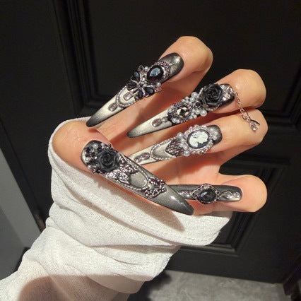 Handmade Black Silver Ombre Long Stiletto Press On Nails. Dark romantic gothic false nails decorated with 3D black roses, vintage cameo portrait, black gems, pearls, silver rhinestones and dangling silver chains.