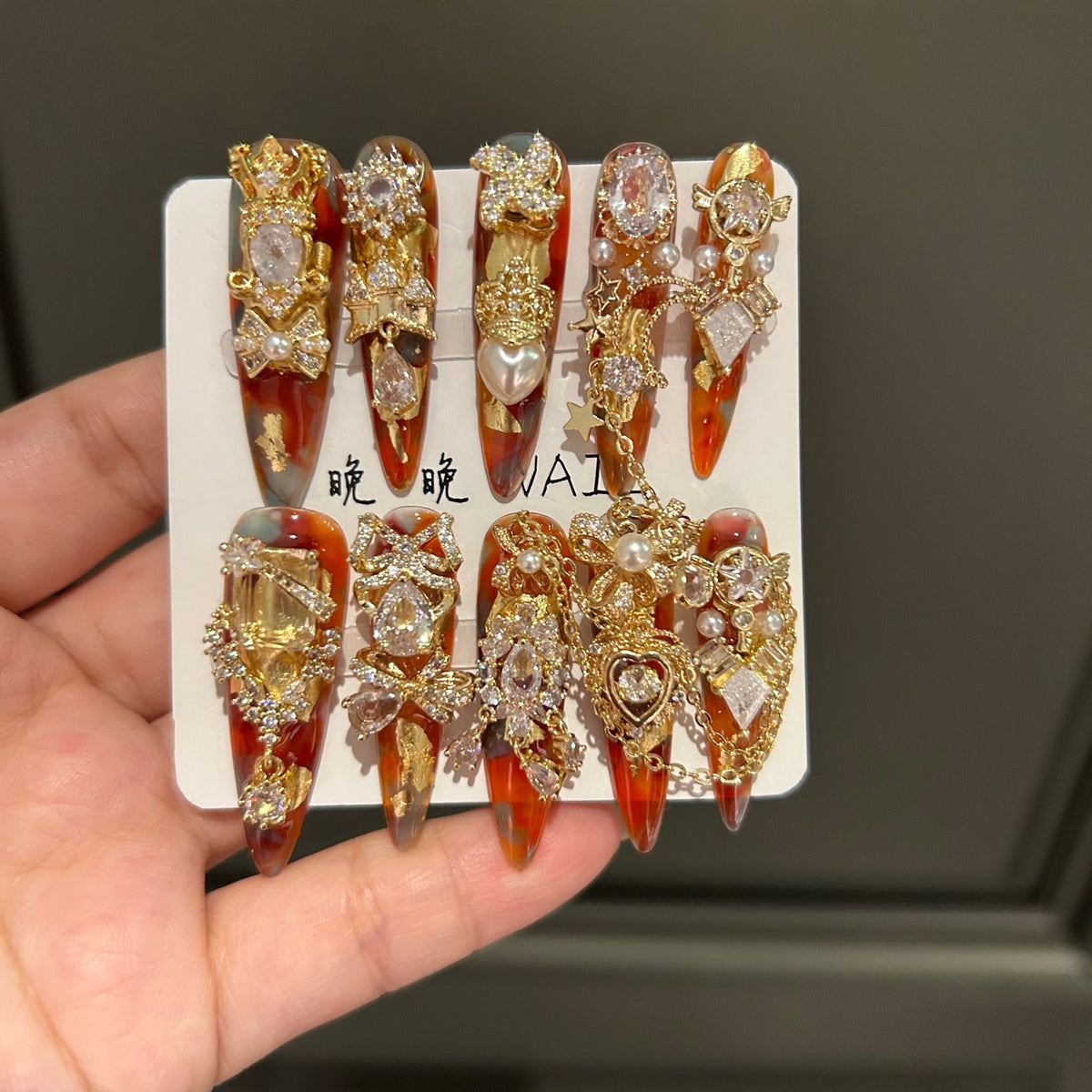 Handmade Amber Marble Long Stiletto Press On Nails with Gold Filigree, Crown & Large Crystal Charms