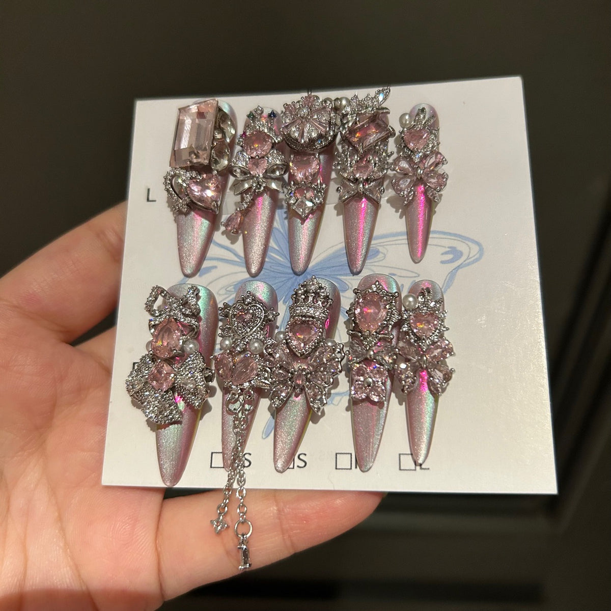 Holographic Pink Cat Eye Stiletto Press-on Nails with 3D Pink Crystal Gems, Bowknot, and Hanging Chain Charms - Luxury Fairy Fake Nail Set