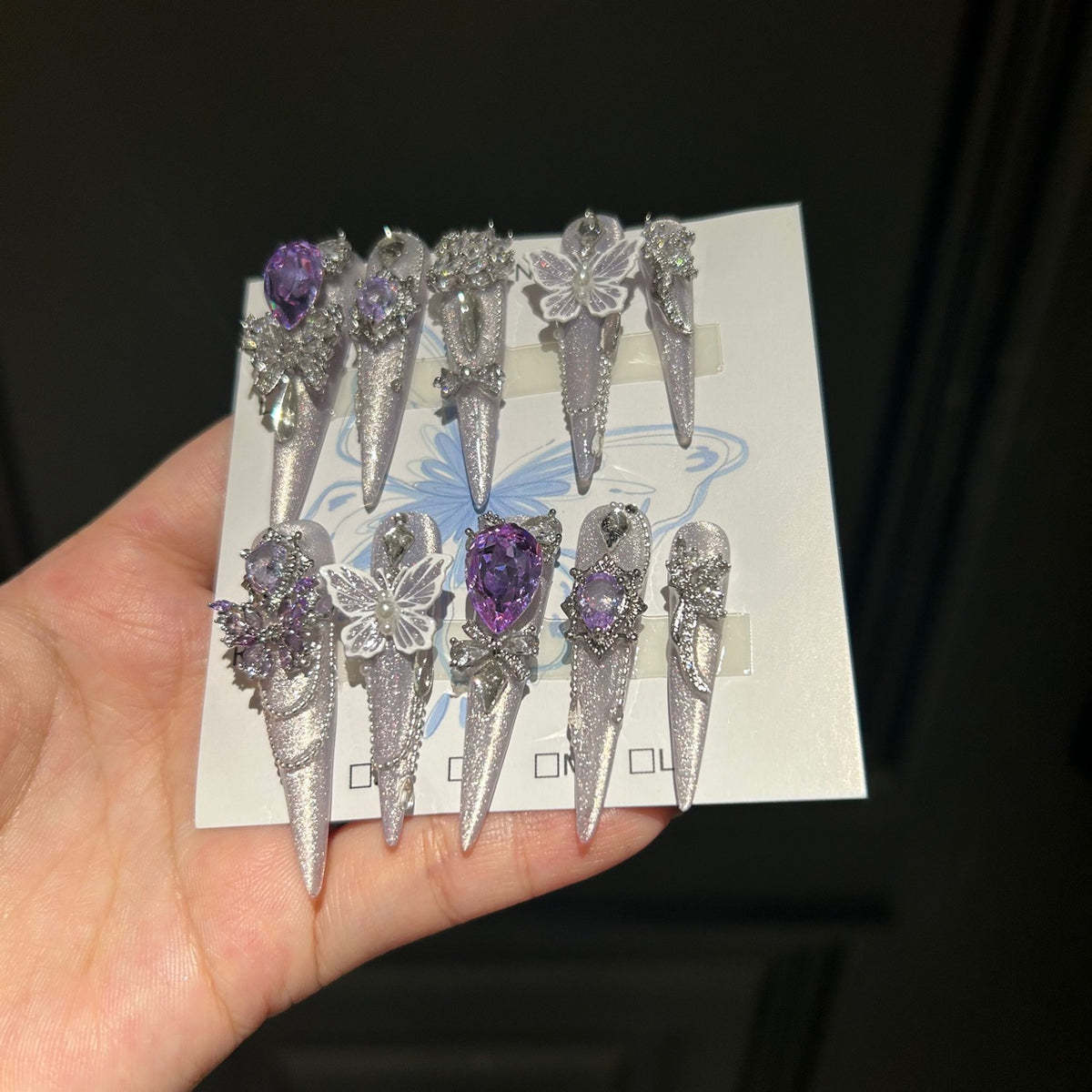 Smoky Purple Cat Eye Stiletto Press-on Nails with Over-sized Purple Crystal, White Bowknot, and Beaded Chain - Luxury Fairy Fake Nail Set